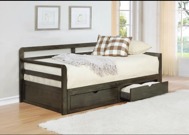 A day bed with drawers underneath it in a bedroom