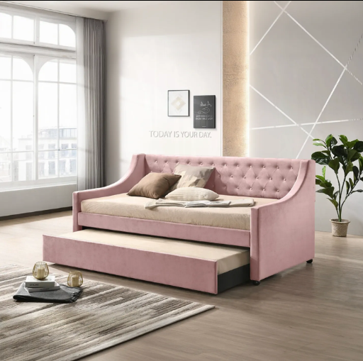 A pink day bed with a pull out bed underneath it