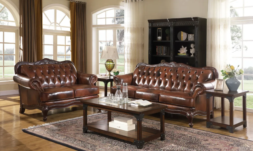 A living room with brown leather furniture and a coffee table