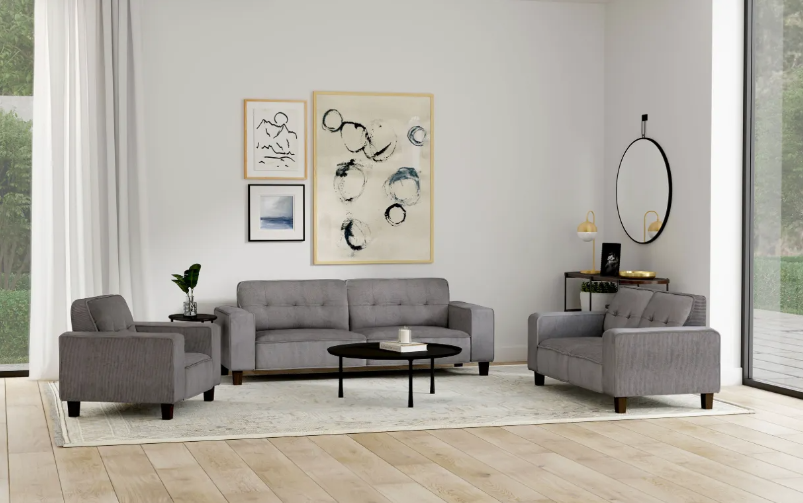 A living room with a couch , two chairs , and a coffee table.