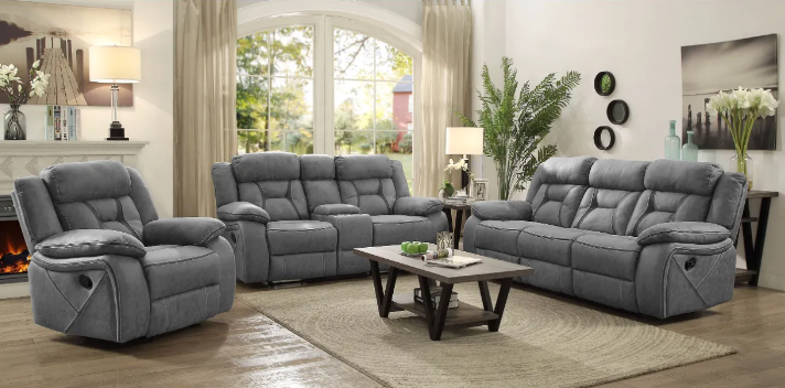 A living room with a couch , two chairs , and a coffee table.