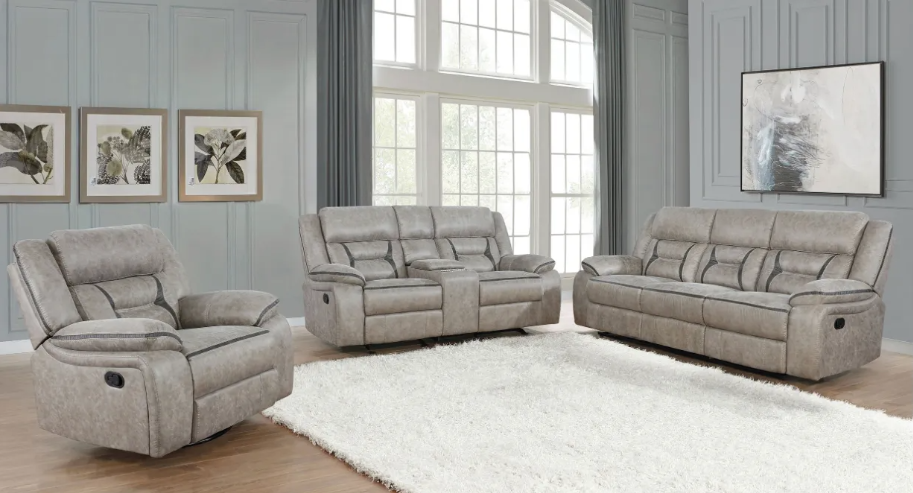 A living room with a couch , chair , and rug.