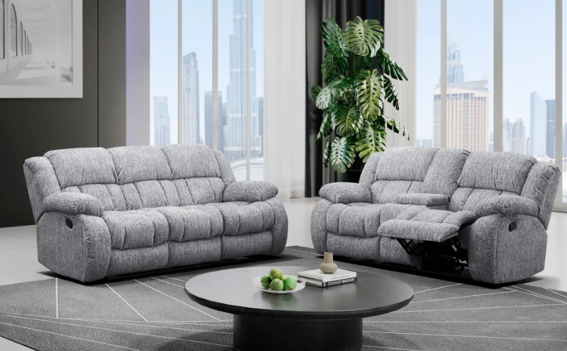 A living room with two reclining couches and a coffee table.