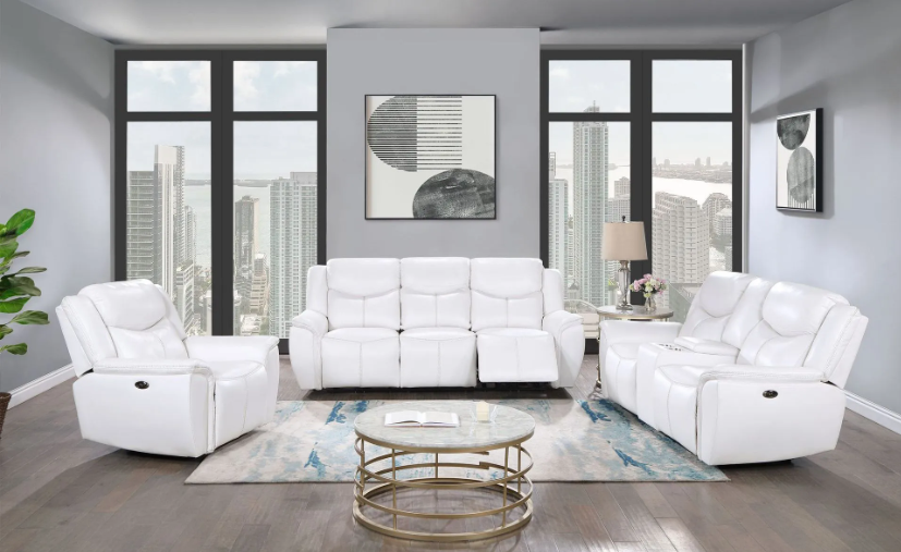 A living room with a couch , two chairs , and a coffee table.