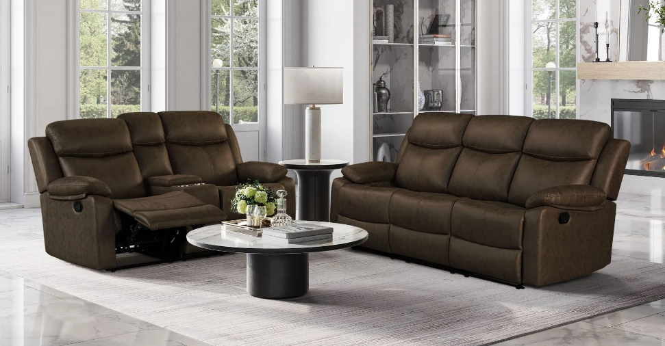 A living room with two brown reclining couches and a coffee table.