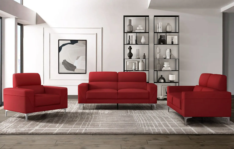 A living room with red furniture and a rug.