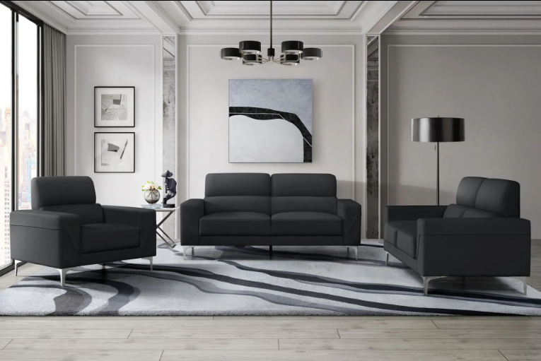 A living room with a couch , chair and rug