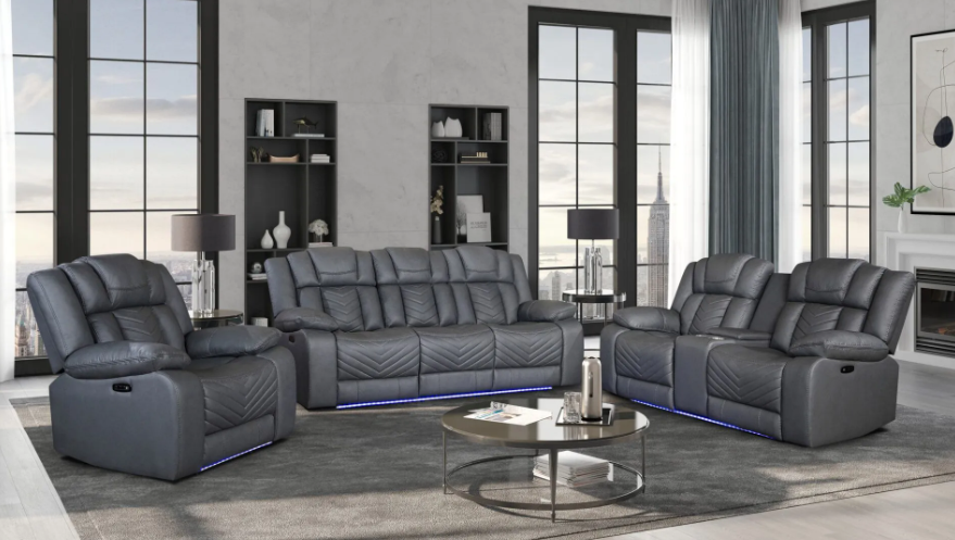 A living room with a couch , two chairs and a coffee table.