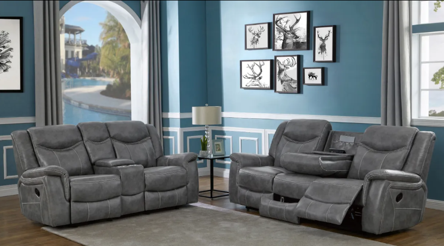 A living room with a couch and two reclining chairs.