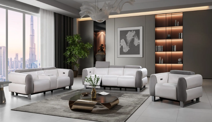 A living room with a couch , two chairs , and a coffee table.