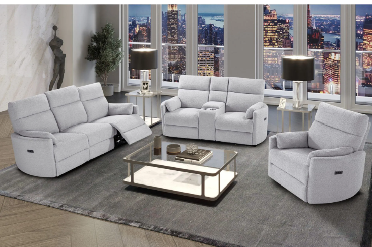 A living room with white furniture and a coffee table