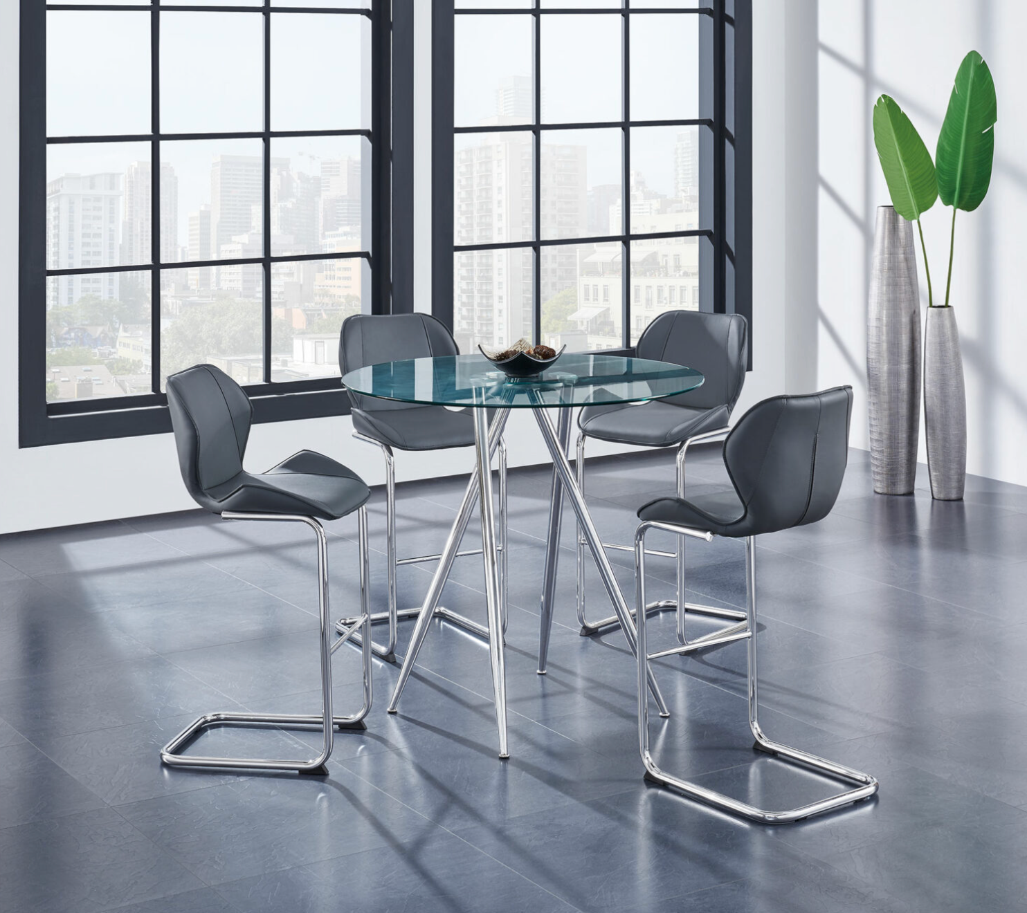 A dining room table and chairs in front of a window