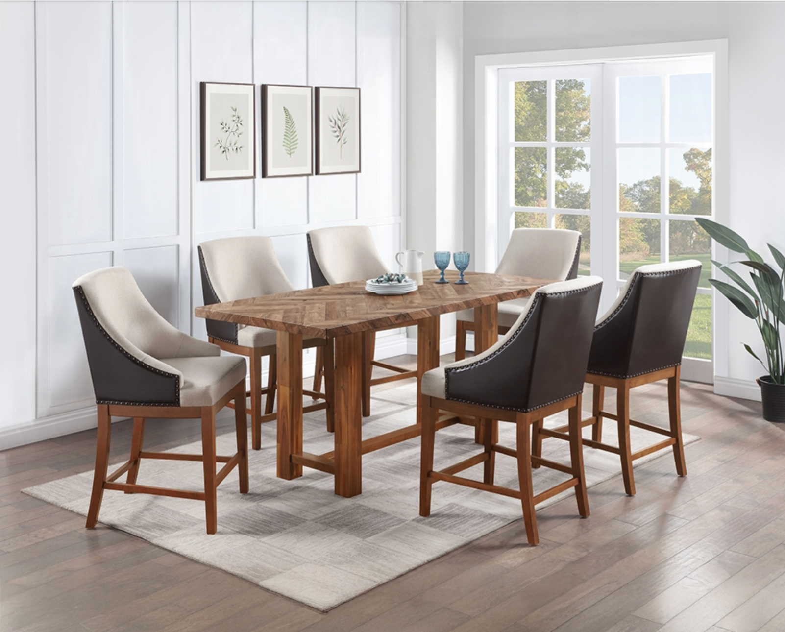 A dining room with a table and chairs and a rug.