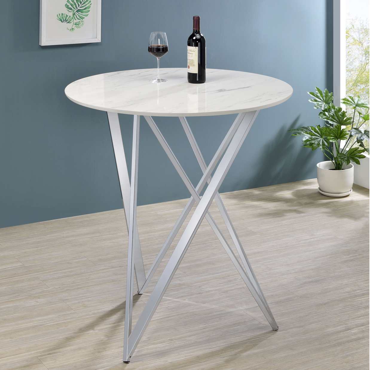 A round table with a bottle of wine and a glass of wine on it