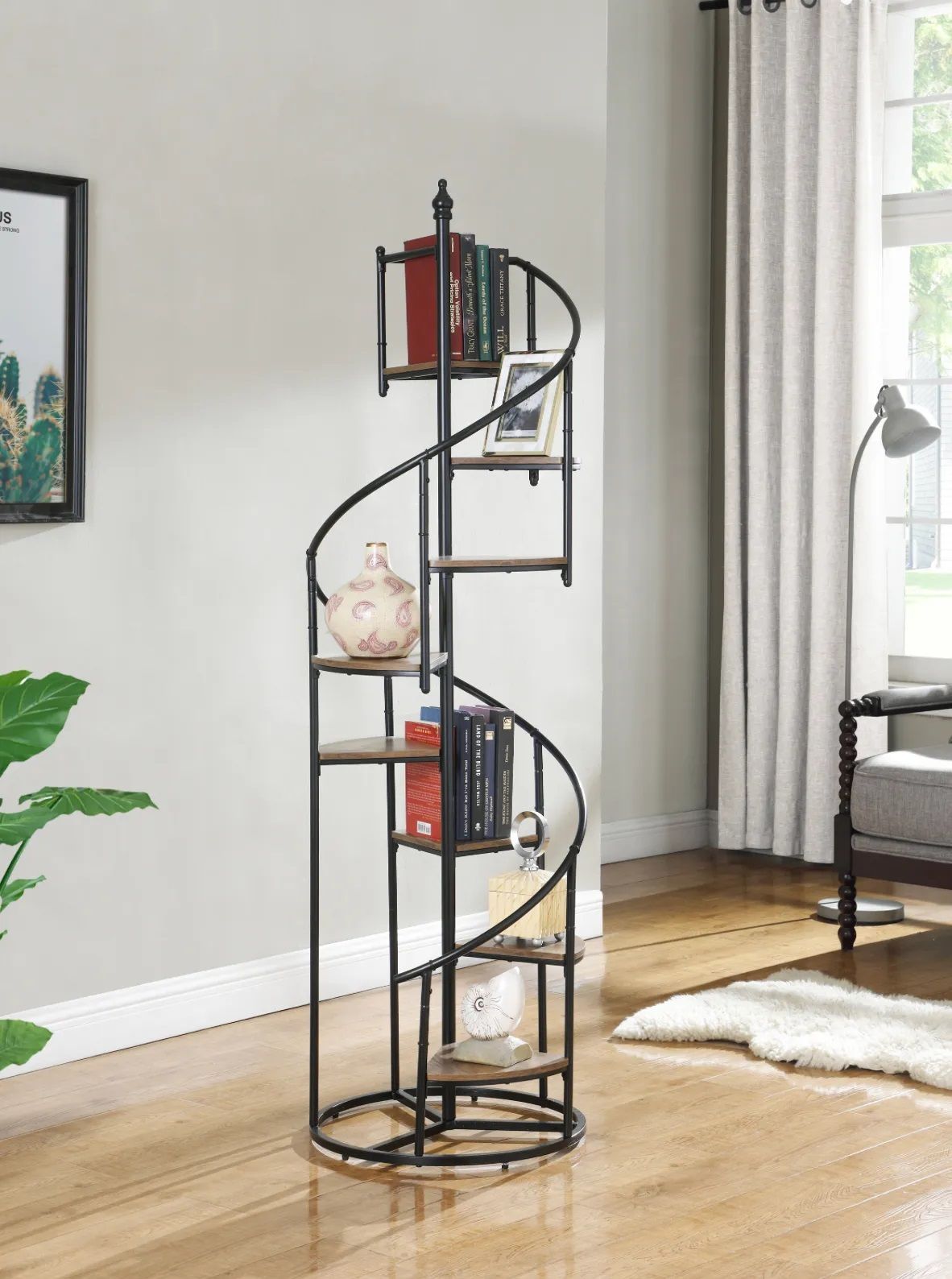 A living room with a spiral bookshelf and a chair.