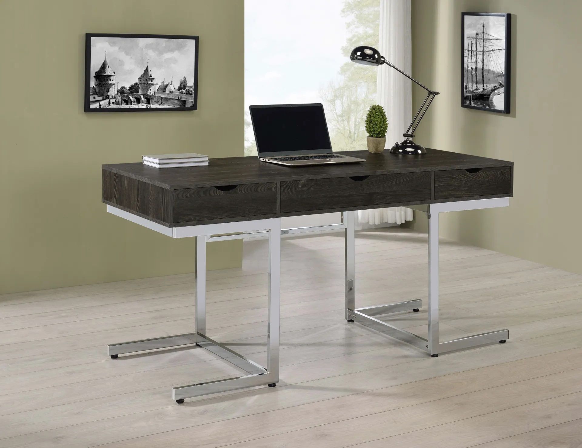 A desk with two drawers and a laptop on it
