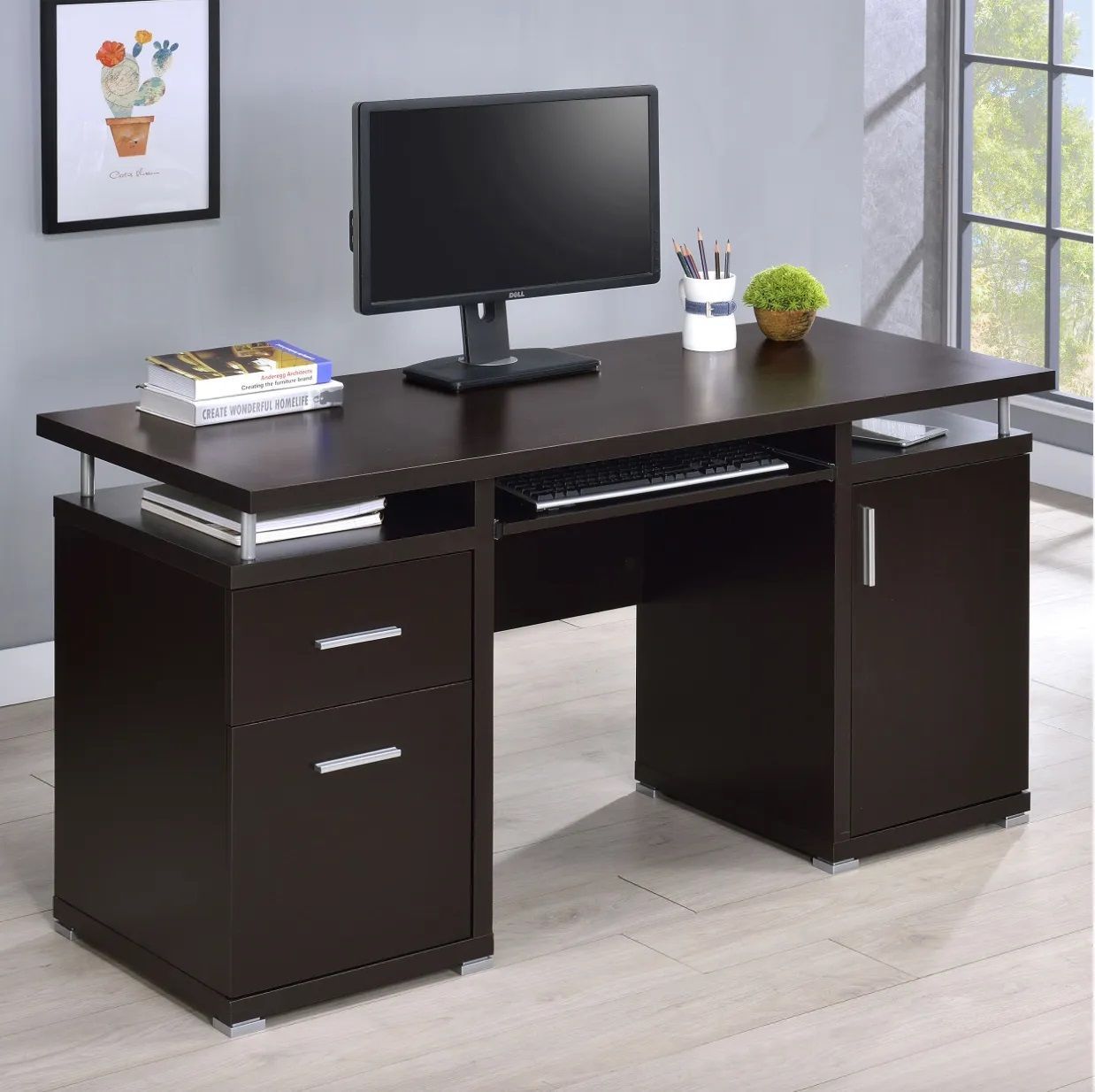 A wooden desk with a computer on top of it.