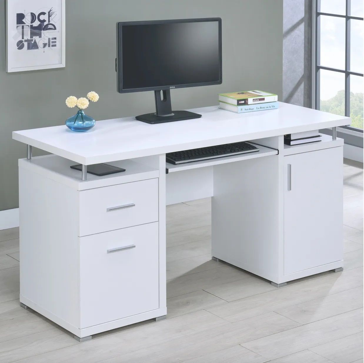 A white desk with a computer on top of it