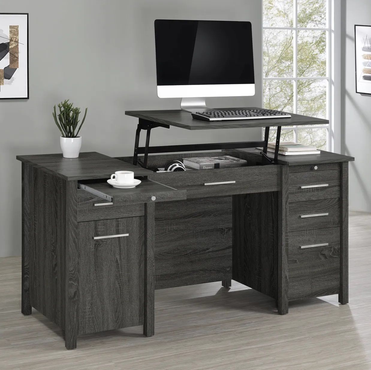 A gray wooden desk with a computer on top of it.