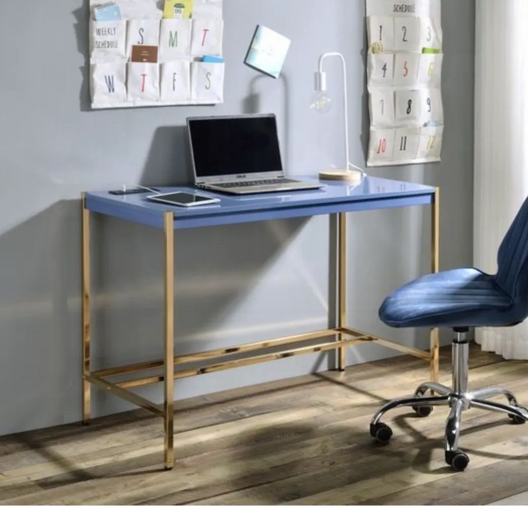 A blue desk with a laptop on it and a blue chair