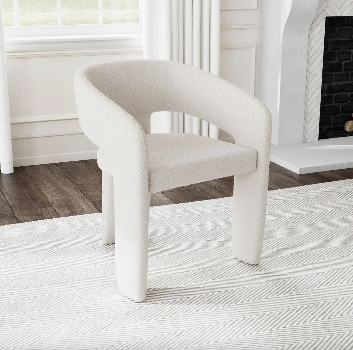 A white chair is sitting on a white rug in a living room next to a fireplace.