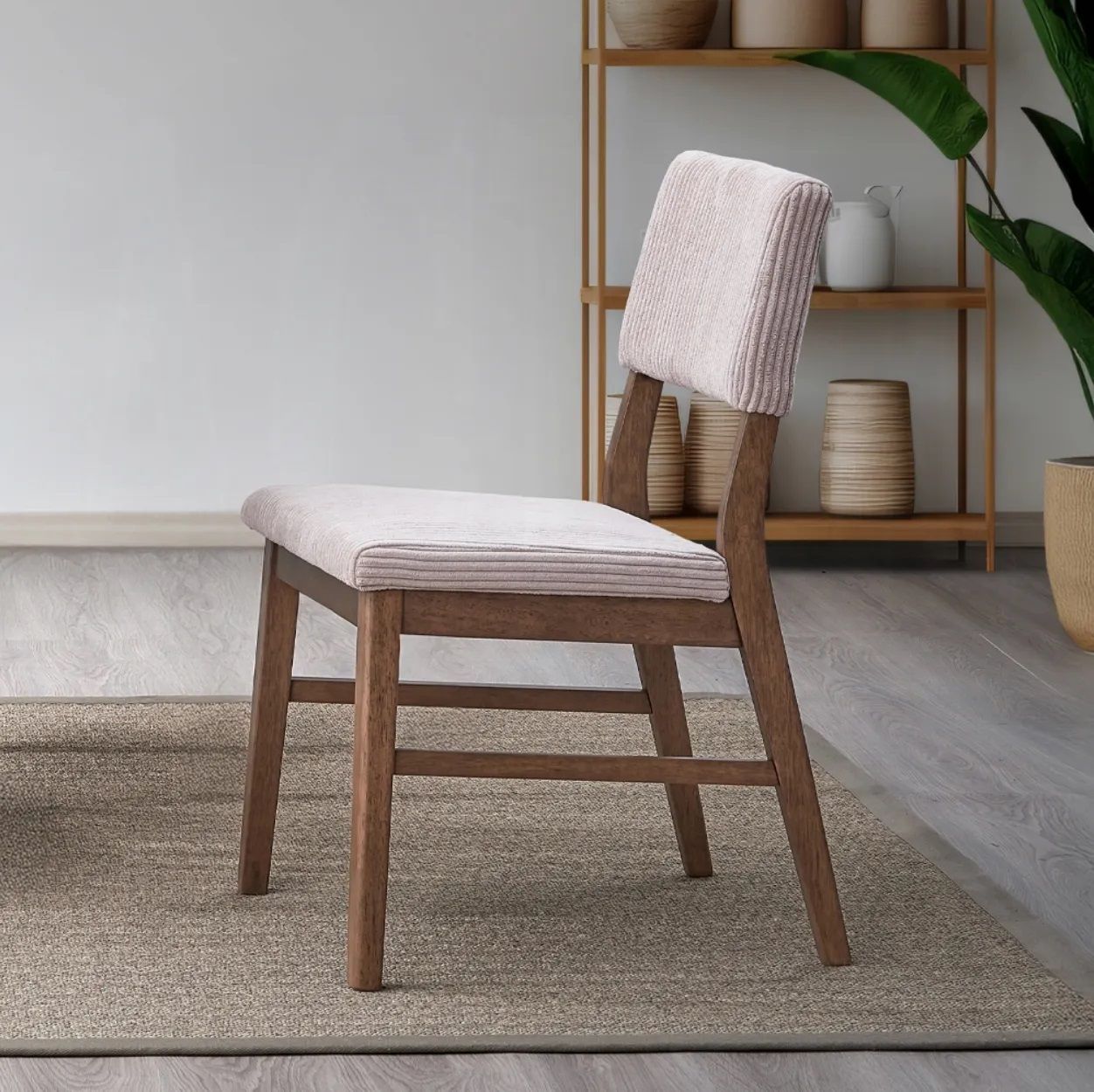 A chair is sitting on a rug in a living room