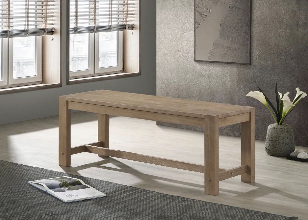 A wooden bench is sitting in a living room next to a window.