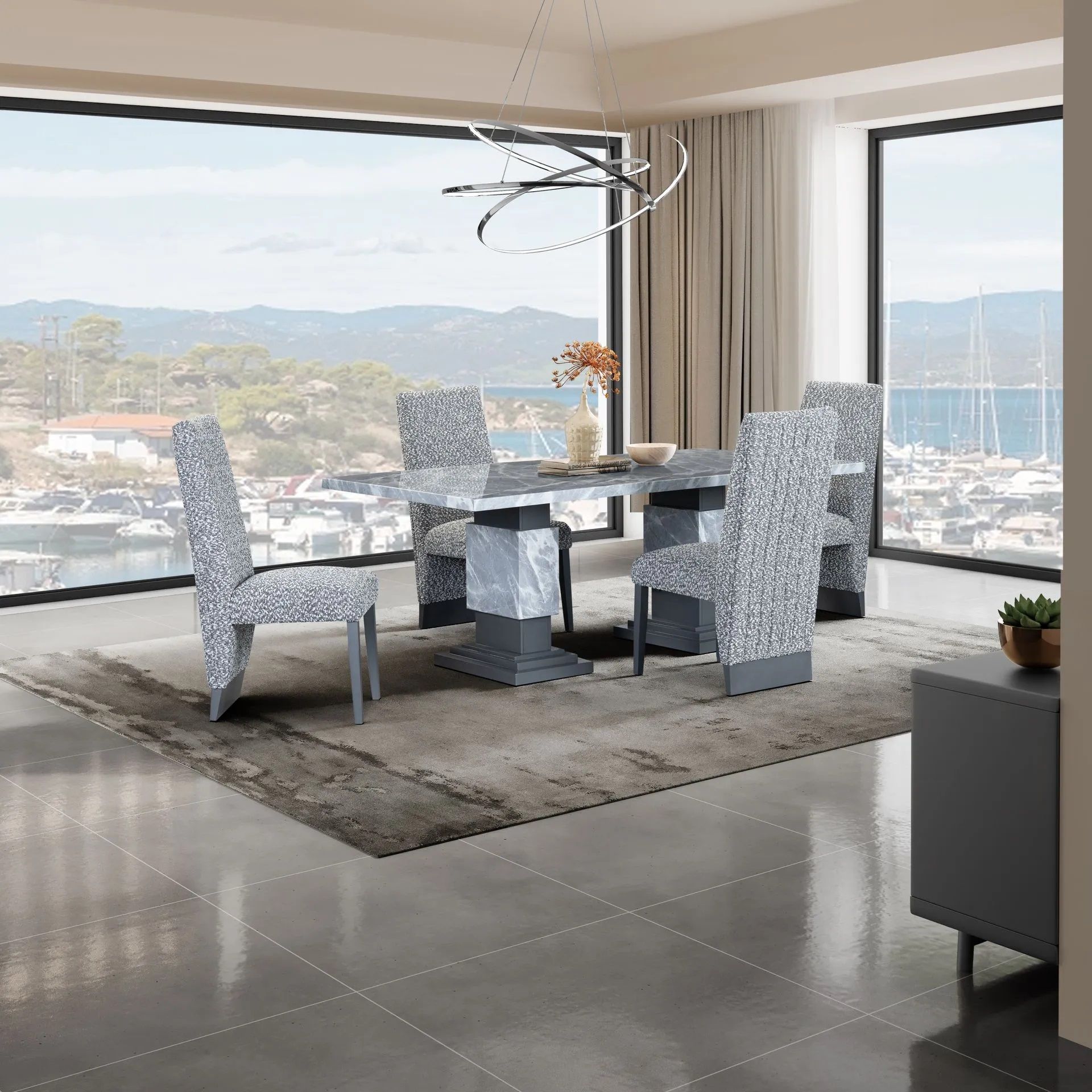 A dining room with a table and chairs with a view of the ocean