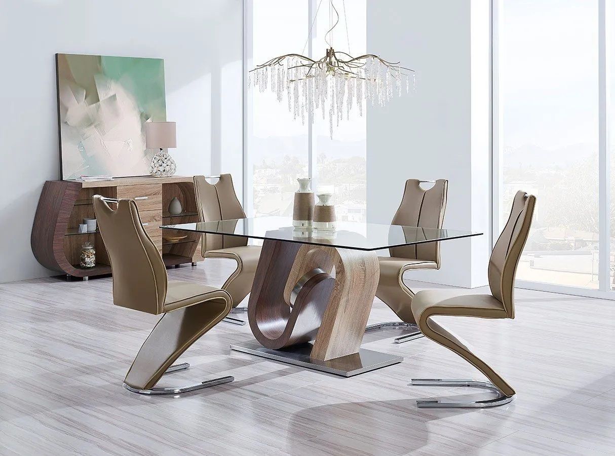A dining room with a glass table and chairs