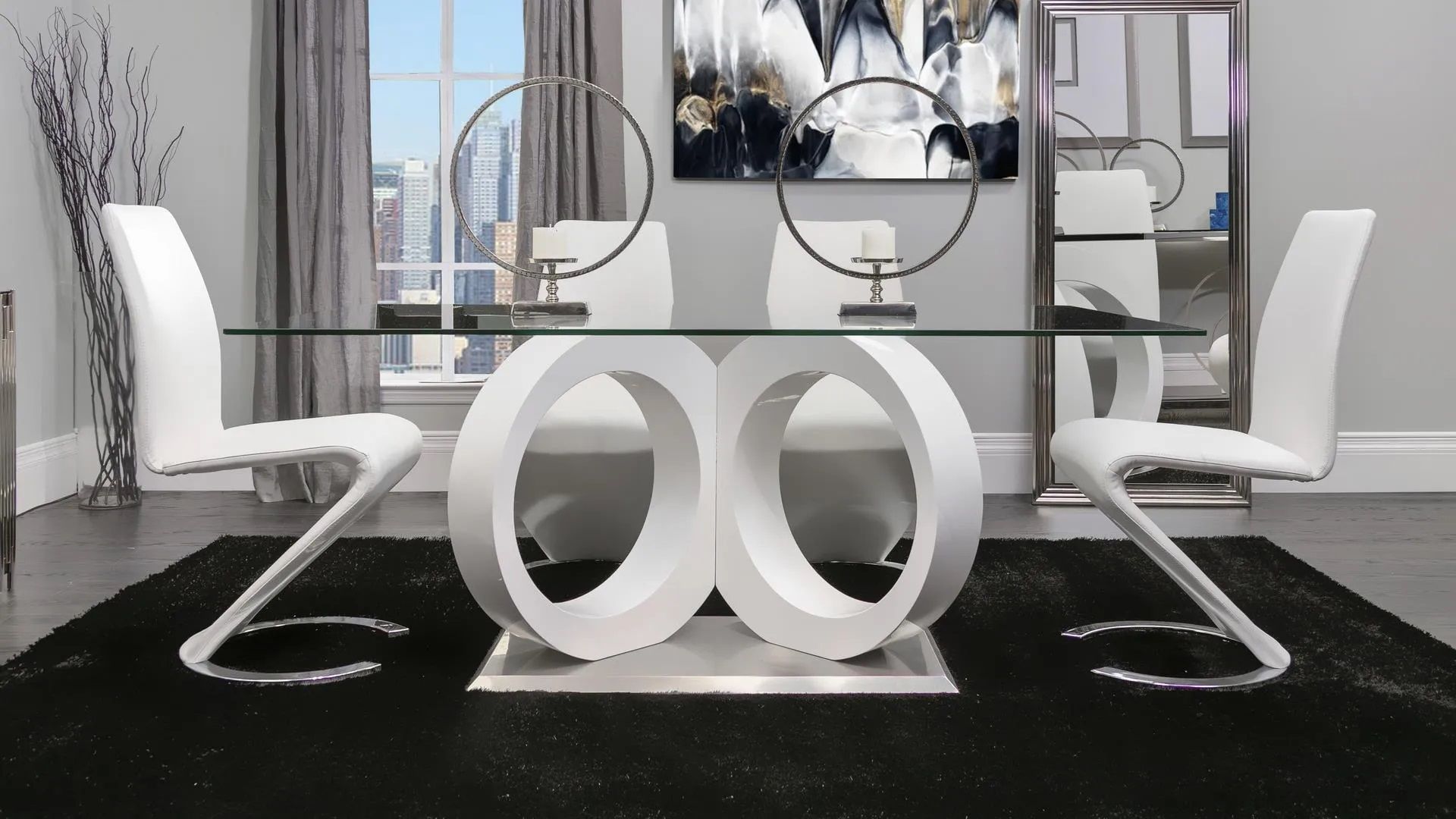 A dining room with a glass table and white chairs