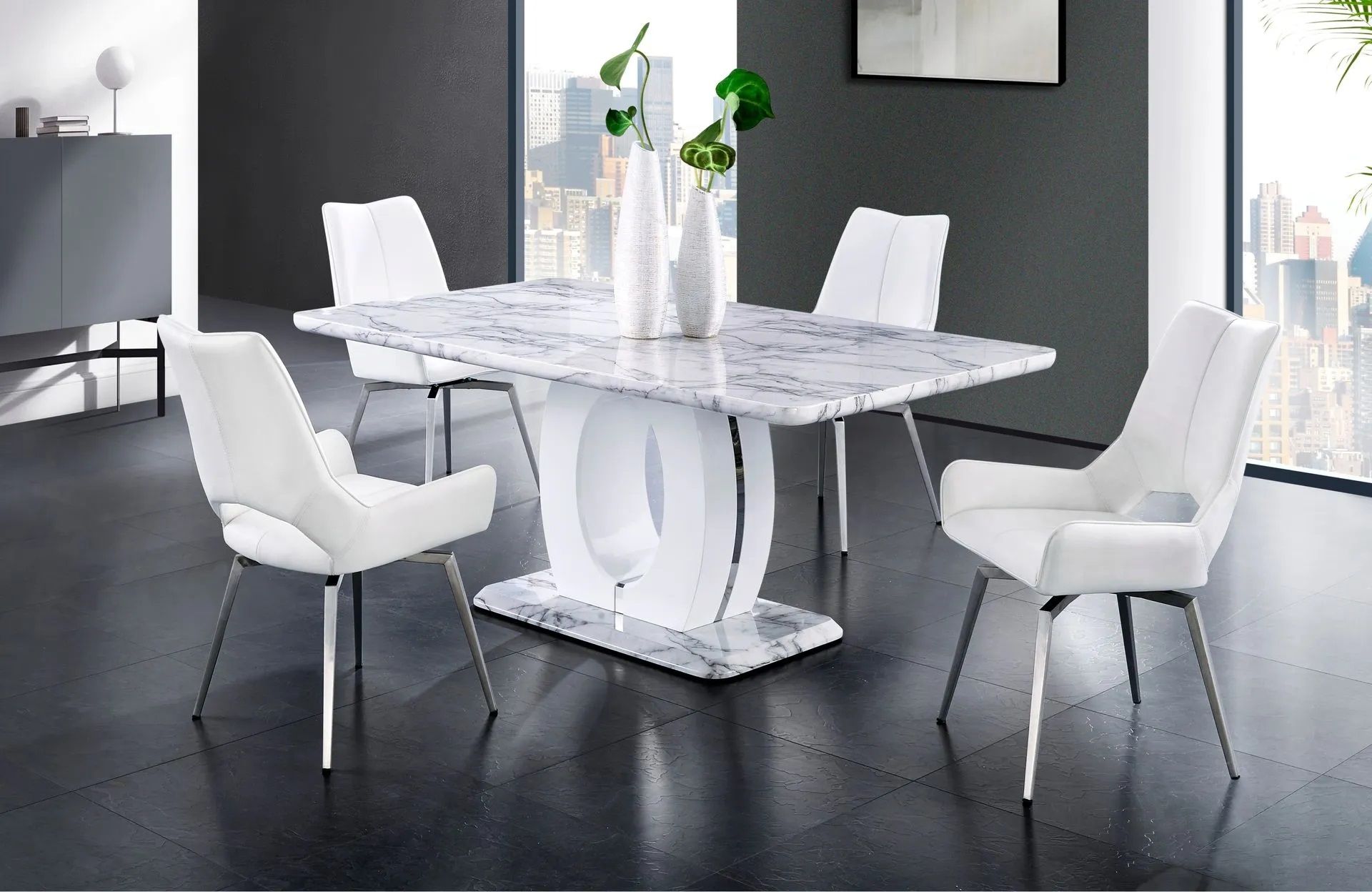 A dining room with a marble table and white chairs