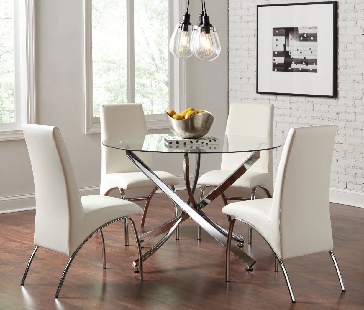 A dining room with a glass table and white chairs