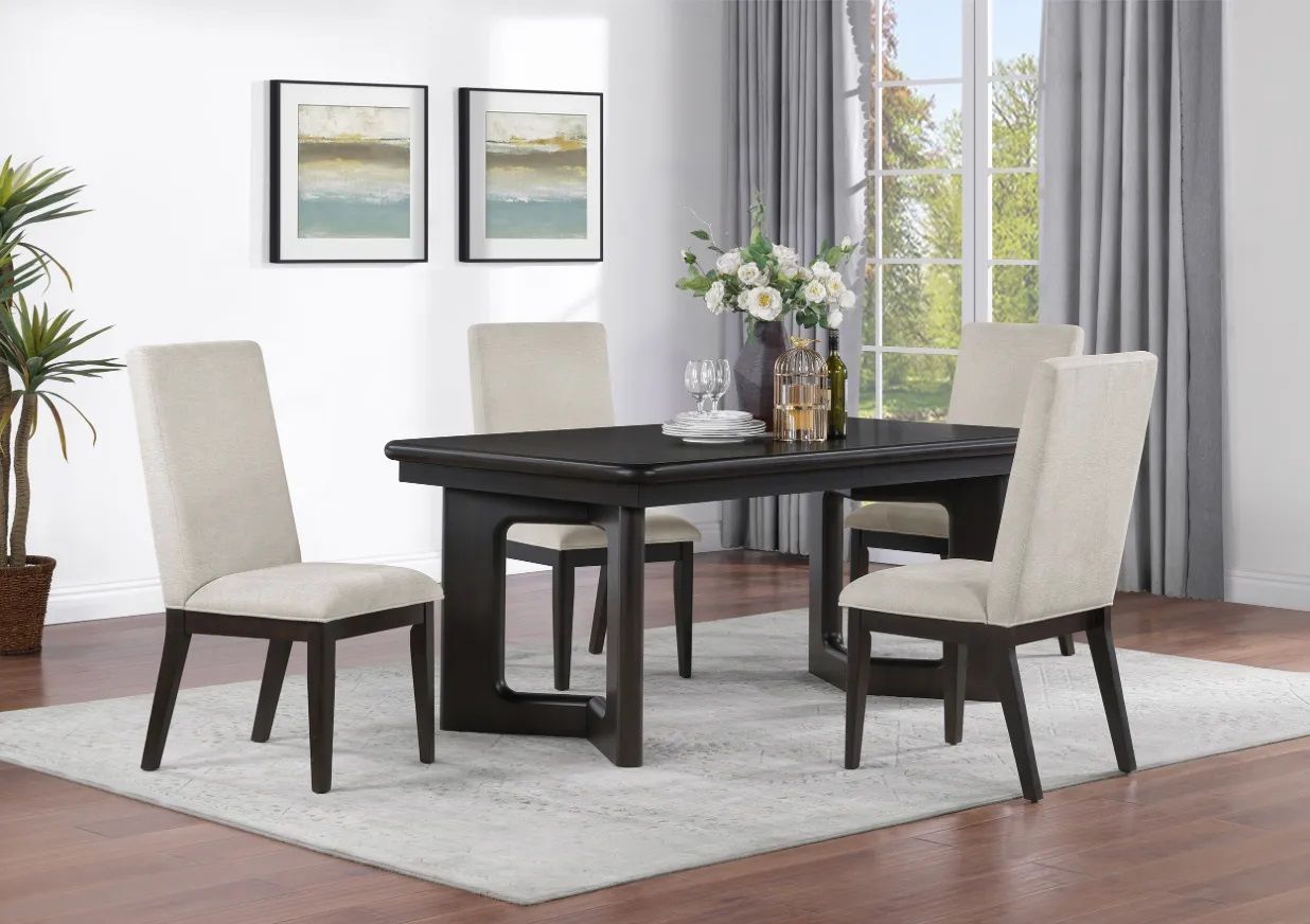 A dining room with a table and chairs and a rug.