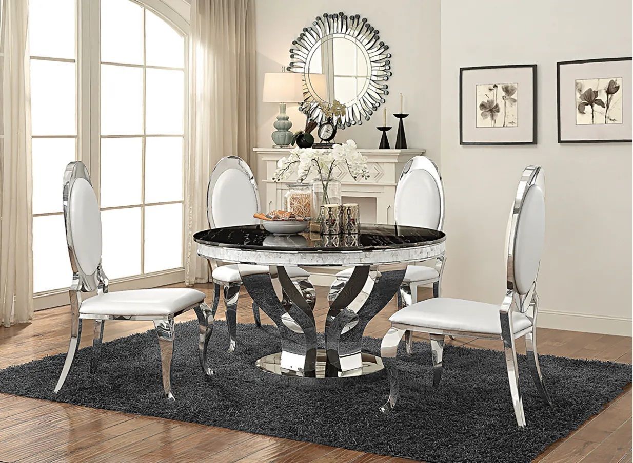 A dining room with a table and chairs and a rug.