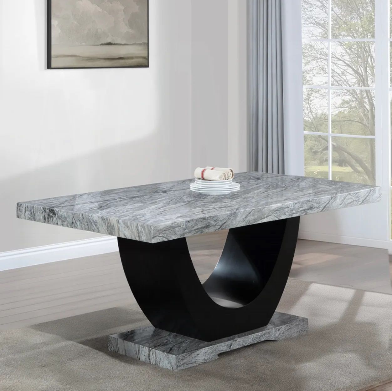 A marble table with a black base in a living room