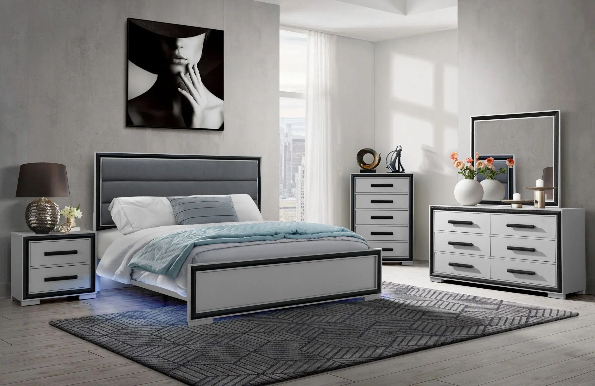 A bedroom with a bed , dresser , nightstand , mirror and rug.