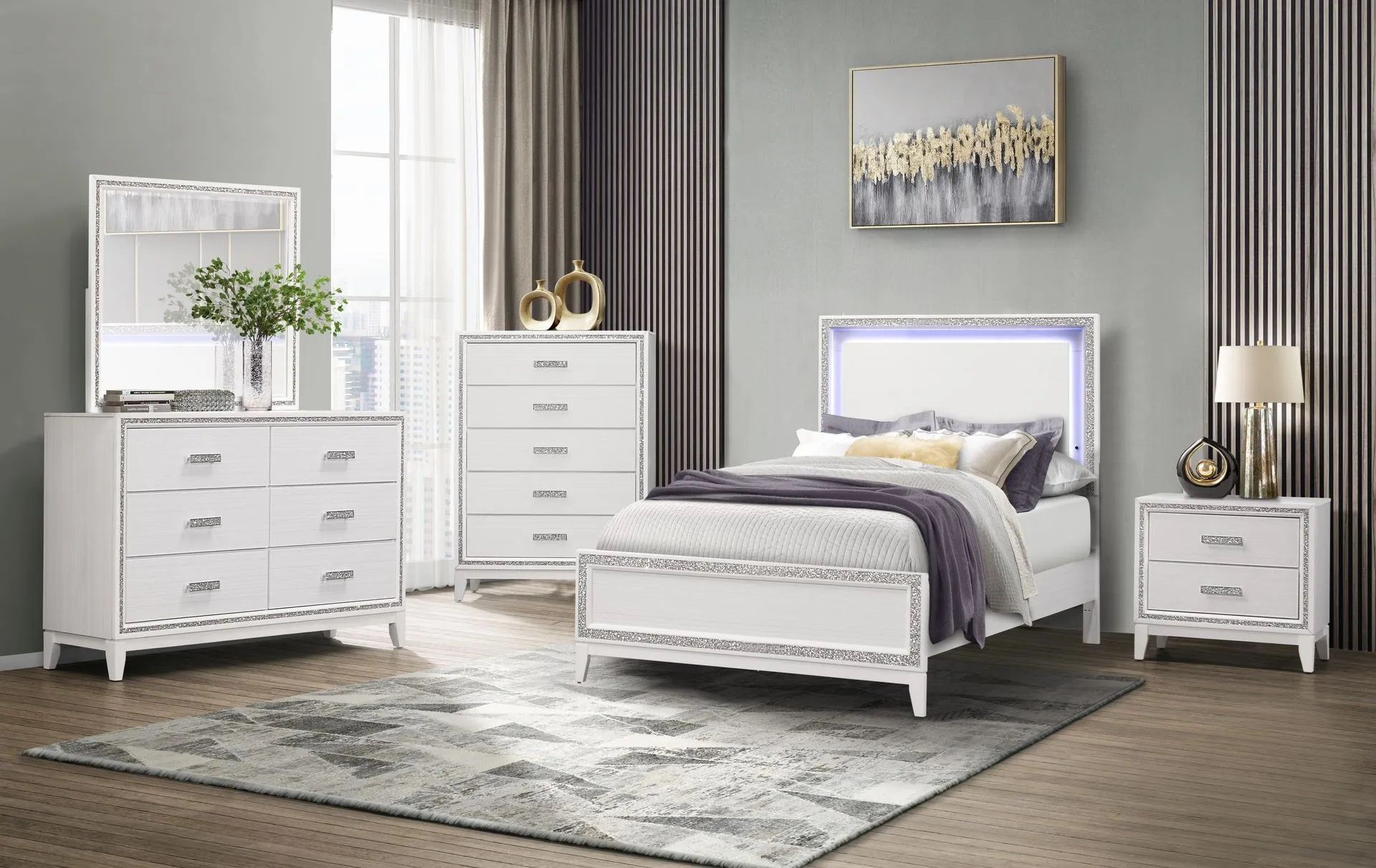 A bedroom with a bed , dresser , nightstand , mirror and rug.