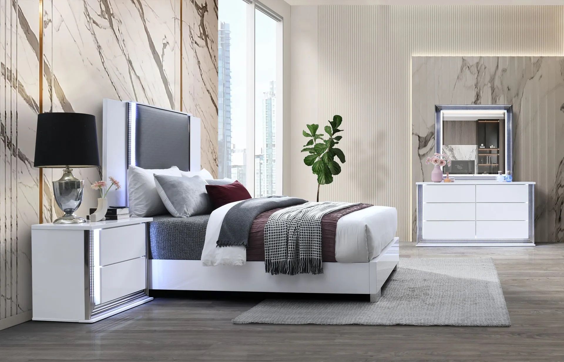 A bedroom with a bed , nightstand , dresser and mirror.