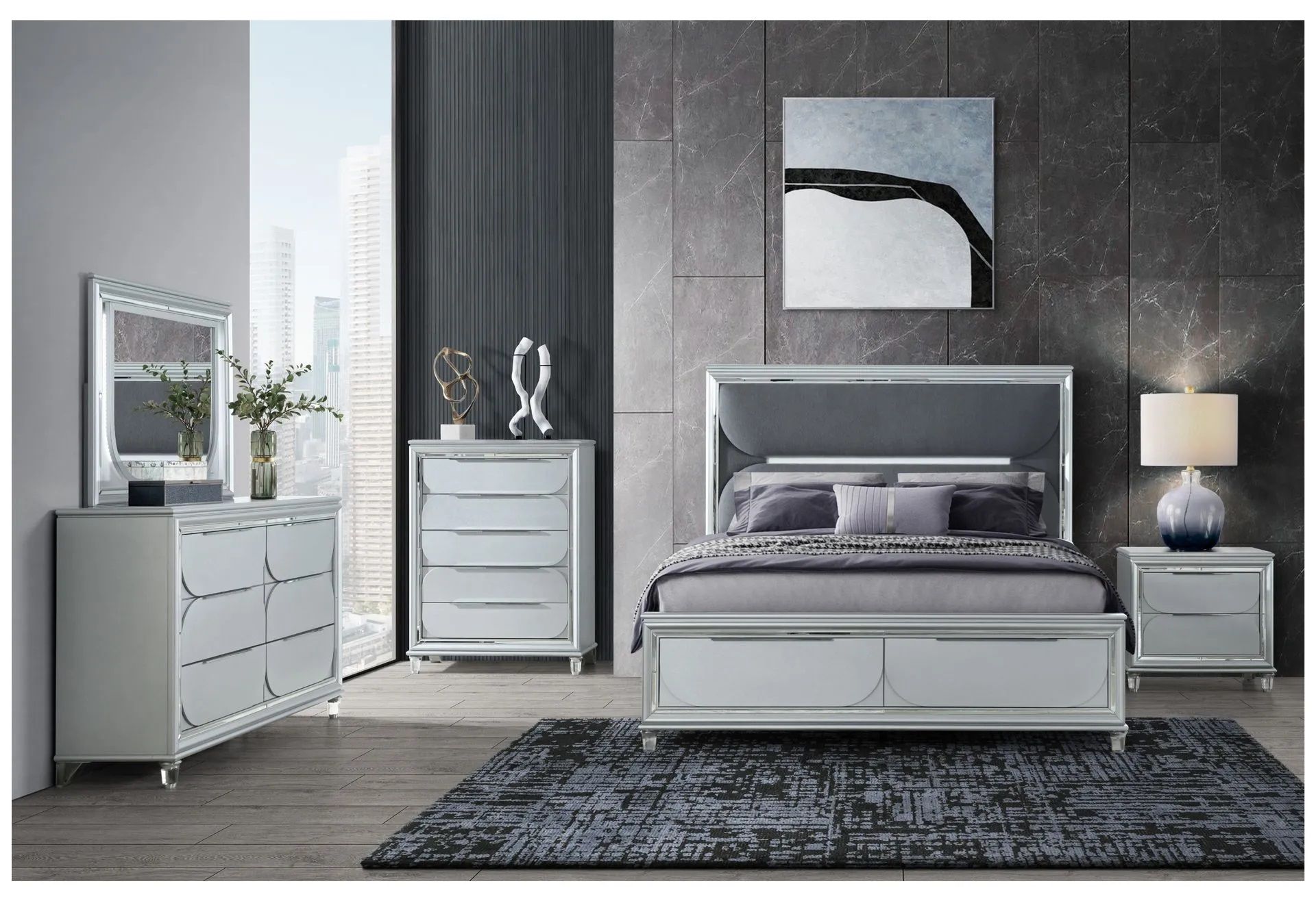 A bedroom with a bed , dresser , nightstand , mirror and rug.