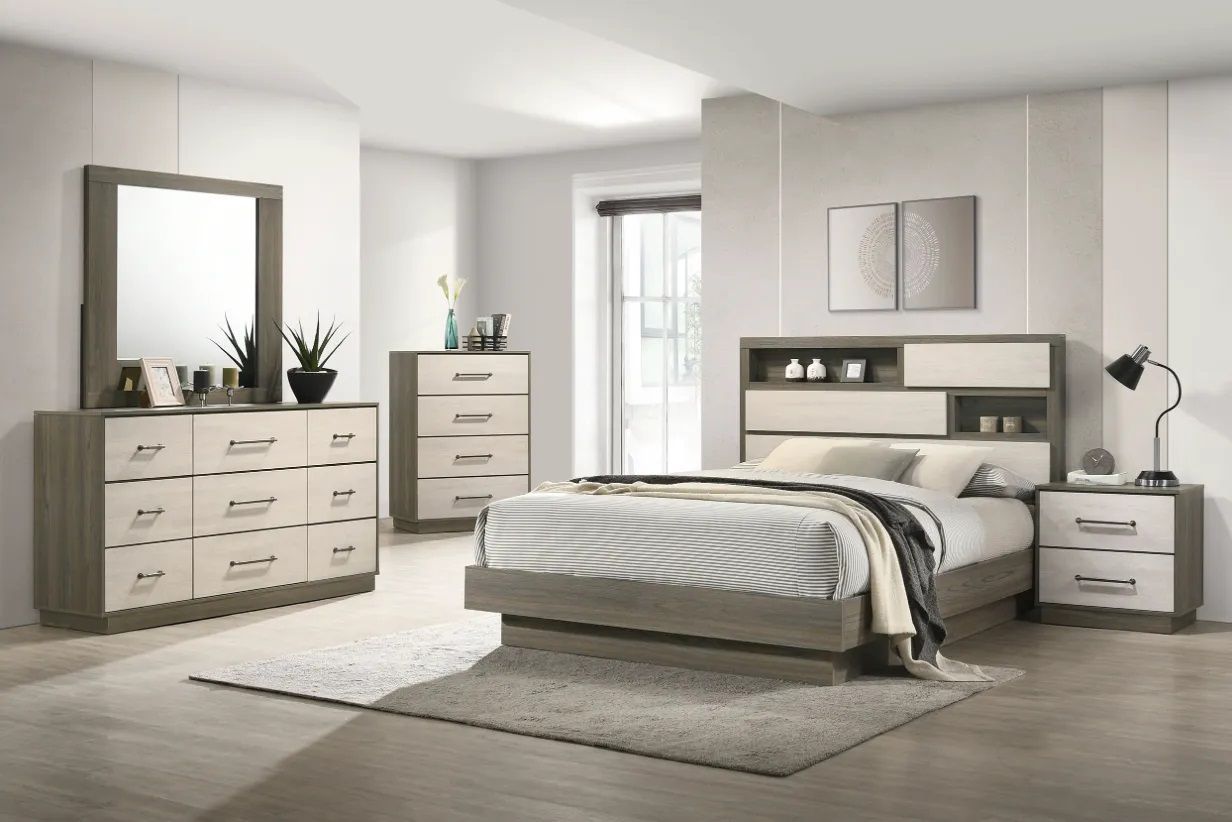 A bedroom with a bed , dresser , nightstand , mirror and rug.