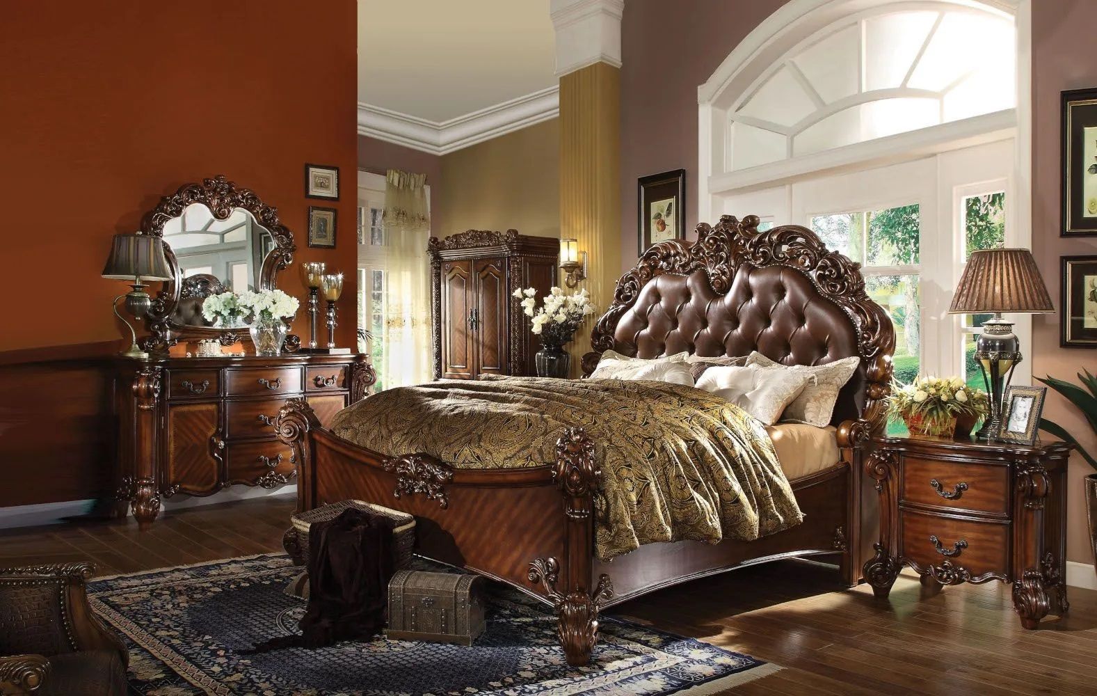 A bedroom with a bed dresser mirror and nightstand