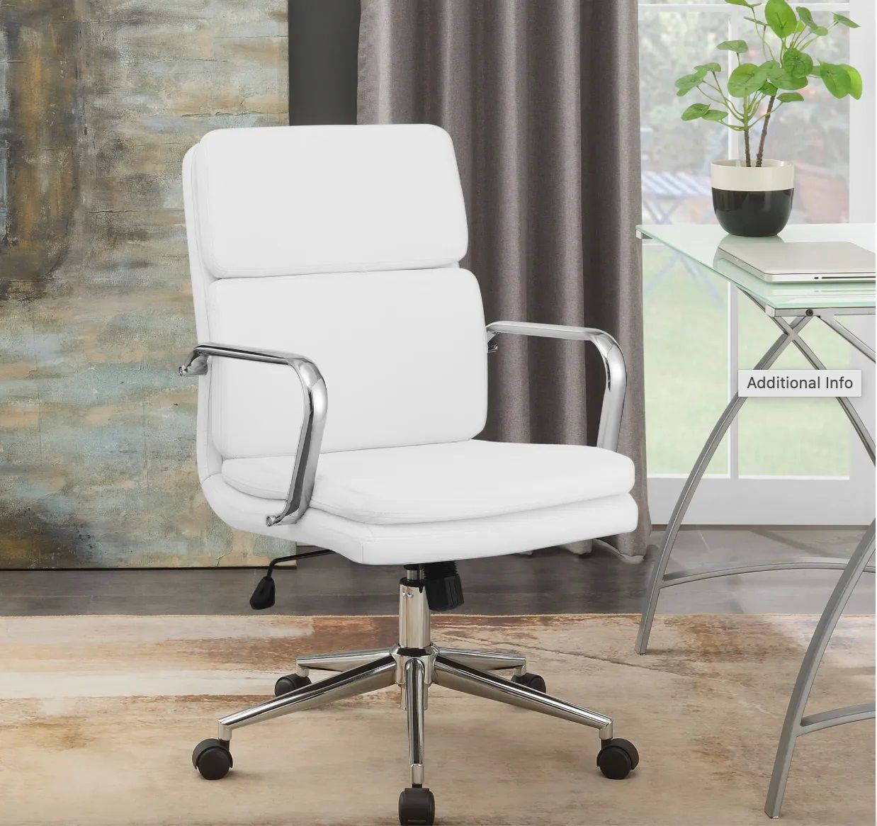 A white office chair is sitting next to a desk in a room.