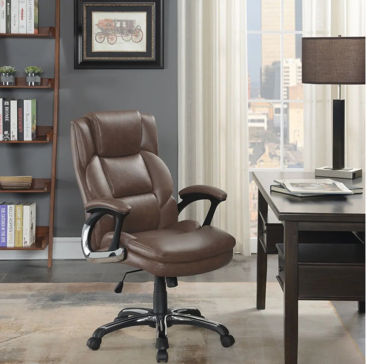 A brown leather office chair sits in front of a desk