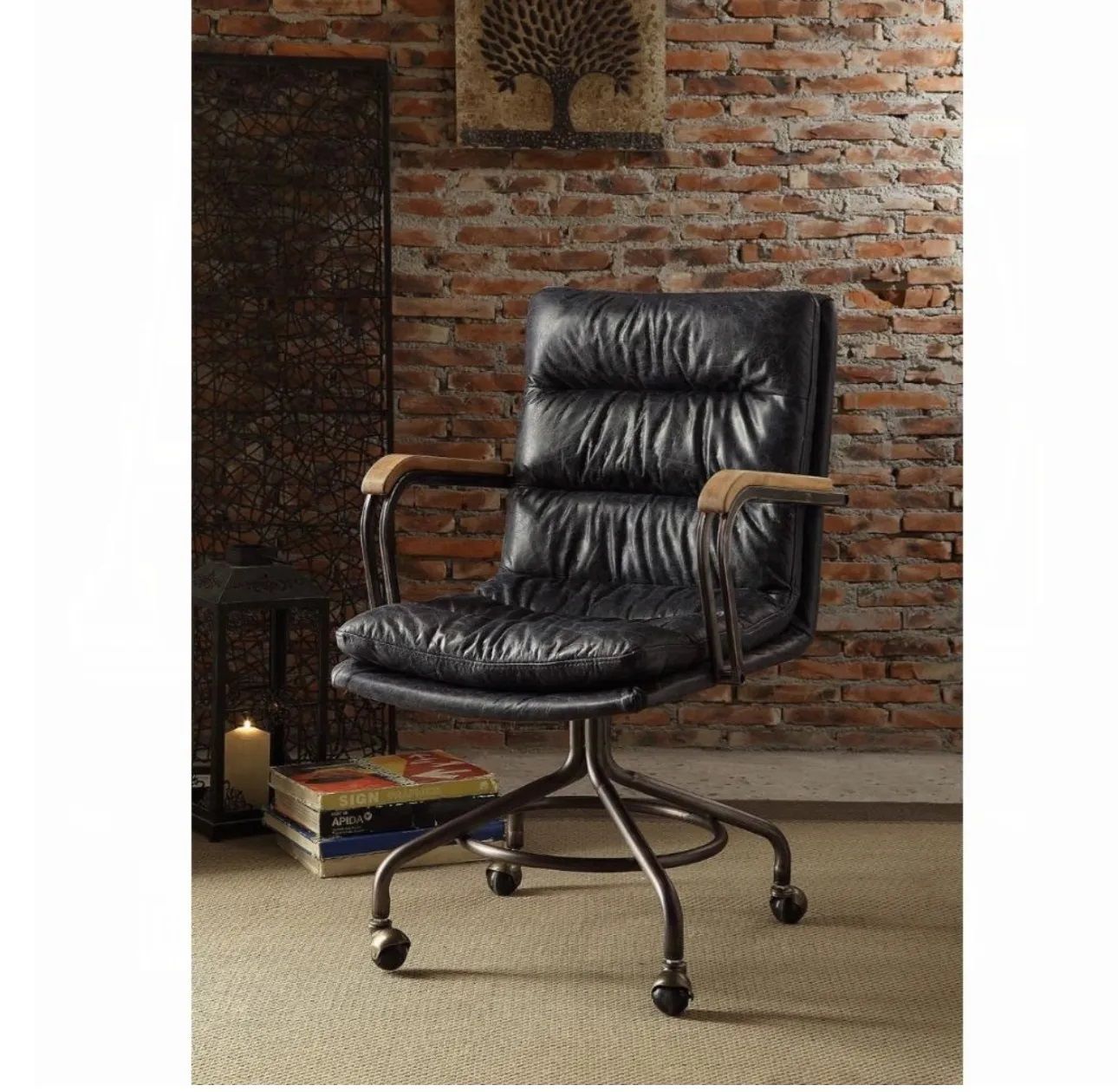 A black leather office chair is sitting in front of a brick wall