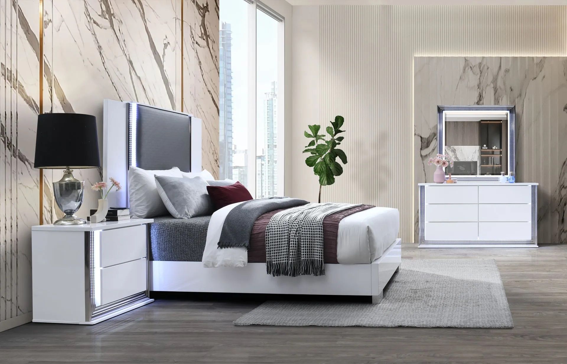 A bedroom with a bed , nightstand , dresser and mirror.