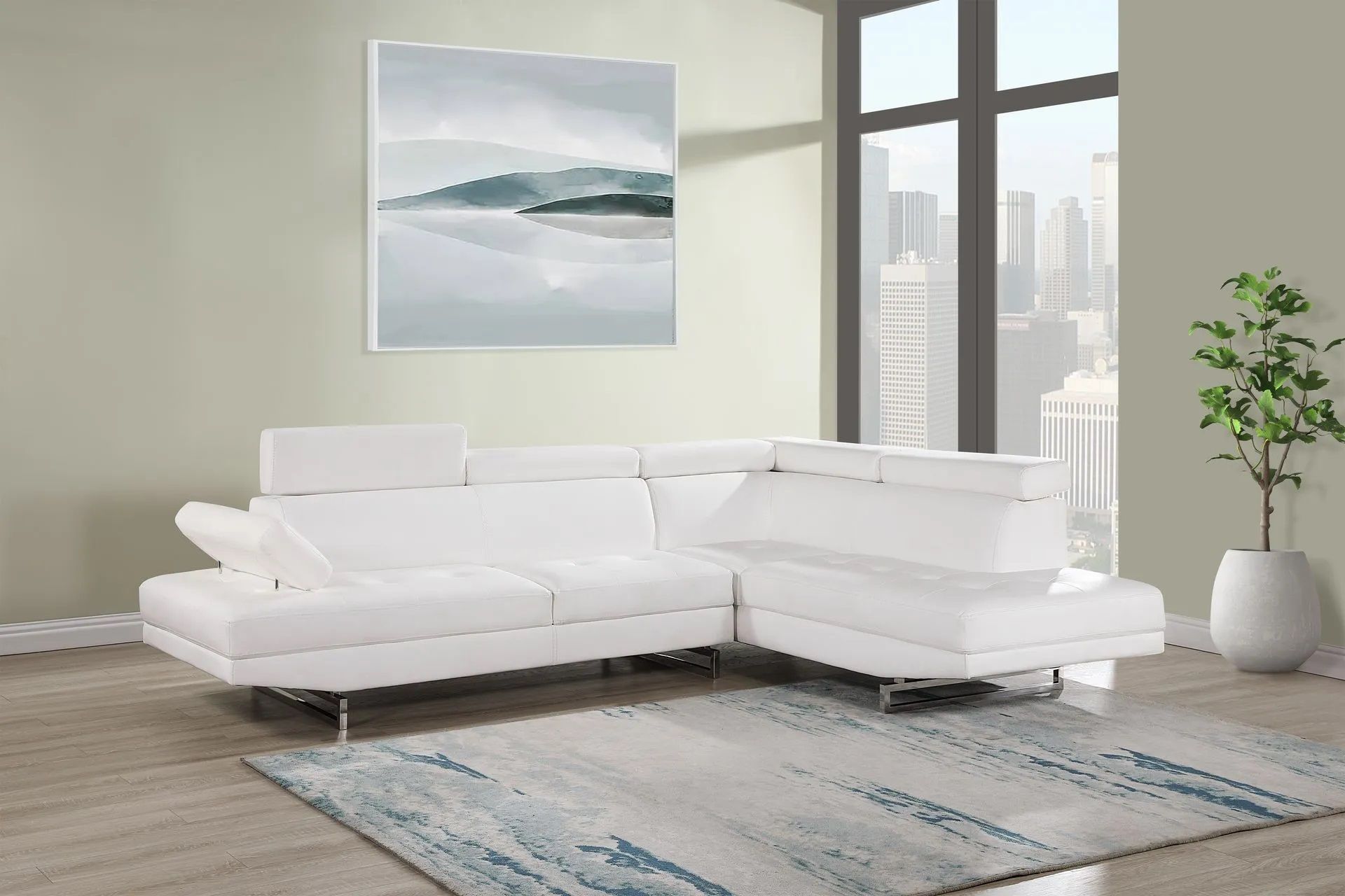 A white sectional couch is sitting in a living room next to a window.