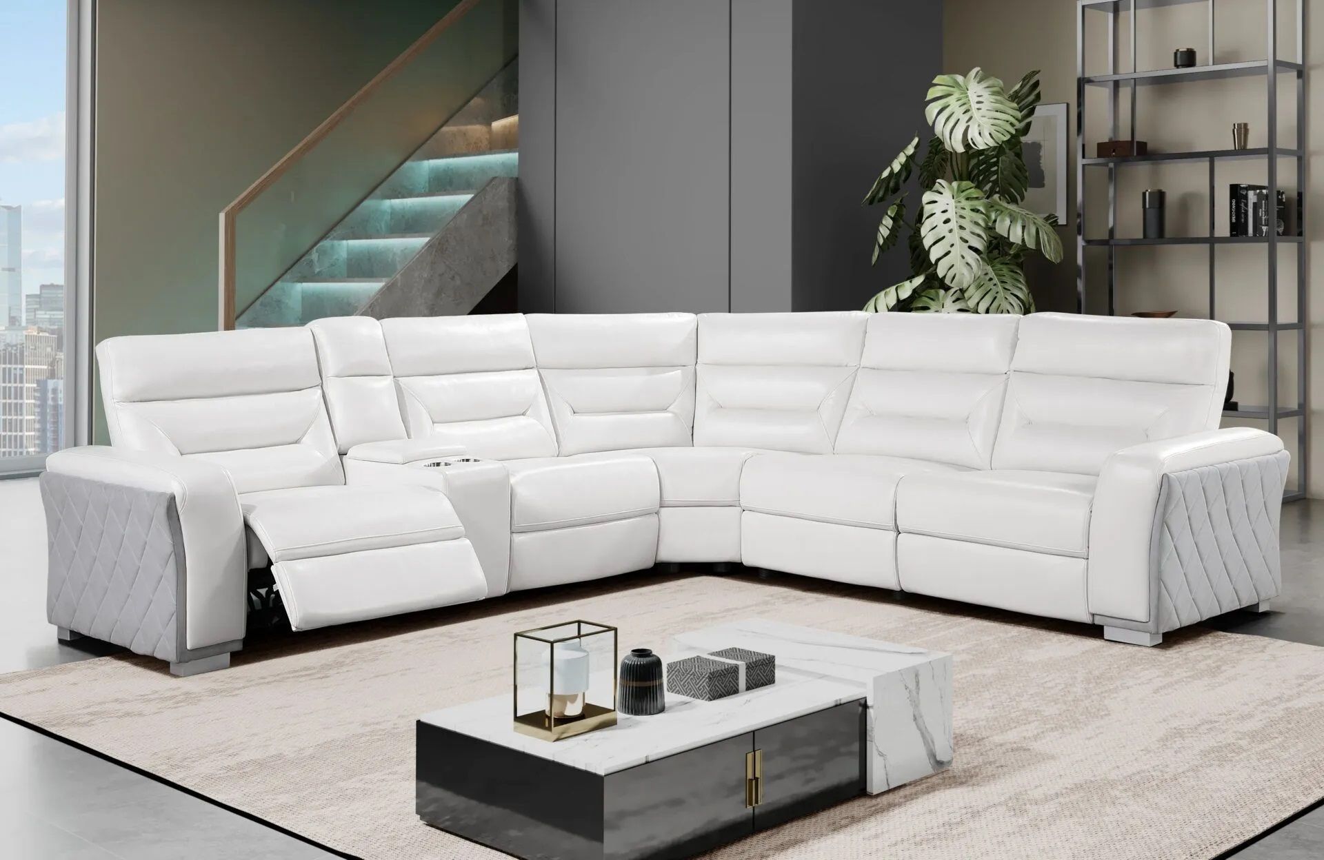 A living room with a white sectional couch and a coffee table.