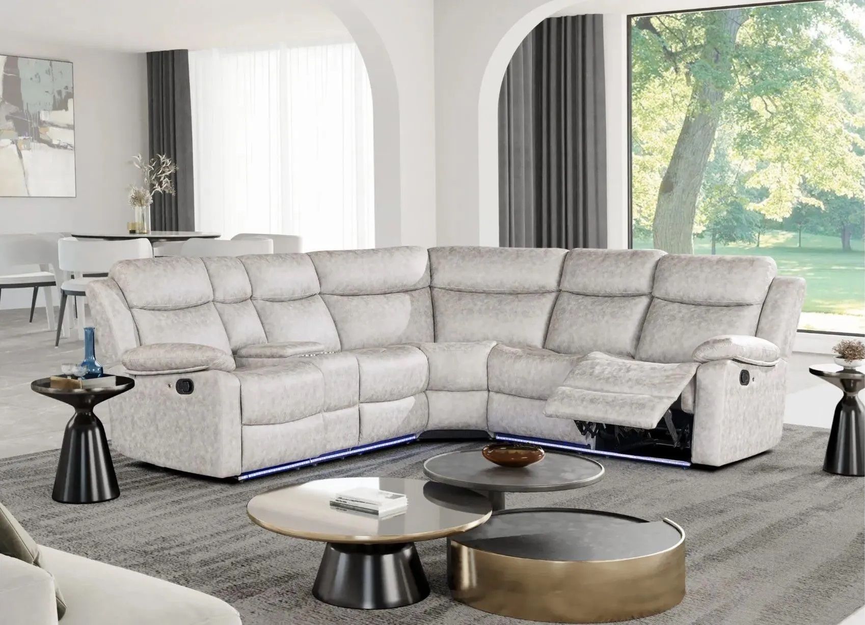A living room with a sectional couch and two coffee tables.