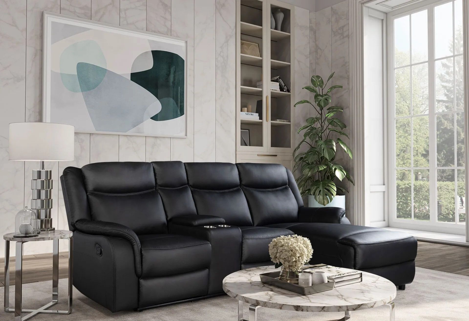 A living room with a black leather sectional couch and a coffee table.