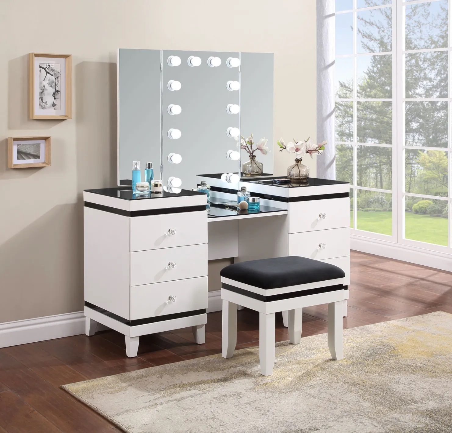 A vanity with a mirror and a stool in a bedroom